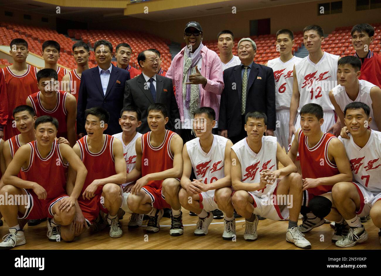 Former NBA basketball star Dennis Rodman poses for pictures with North