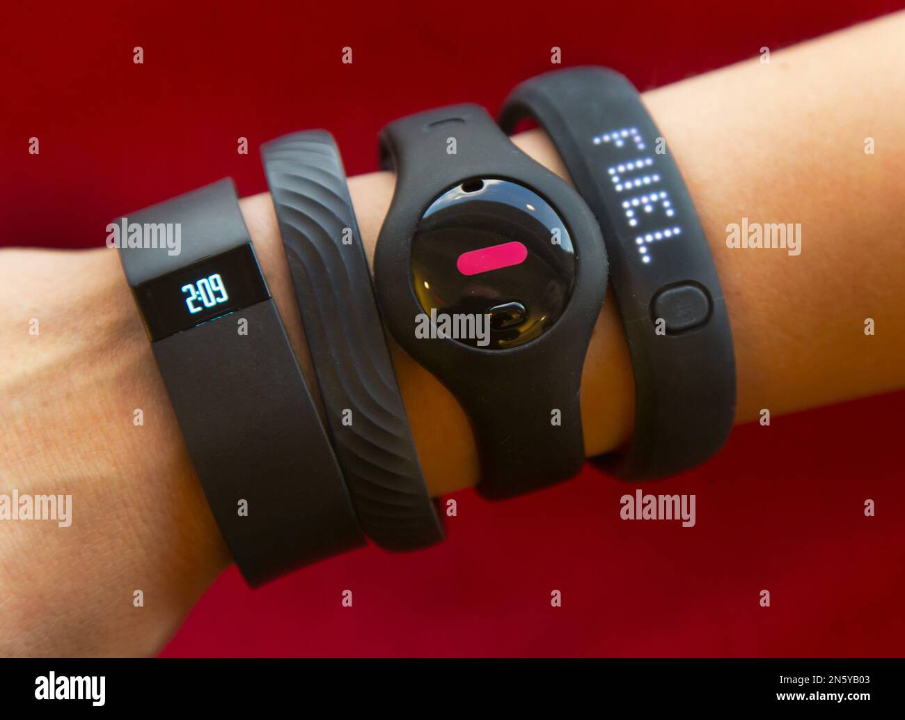 Four fitness trackers are shown in this photograph, in New York, Monday,  Dec. 16, 2013. They are, from left, Fitbit Force, Jawbone Up, Fitbug Orb,  and the Nike FuelBand SE. For aspiring