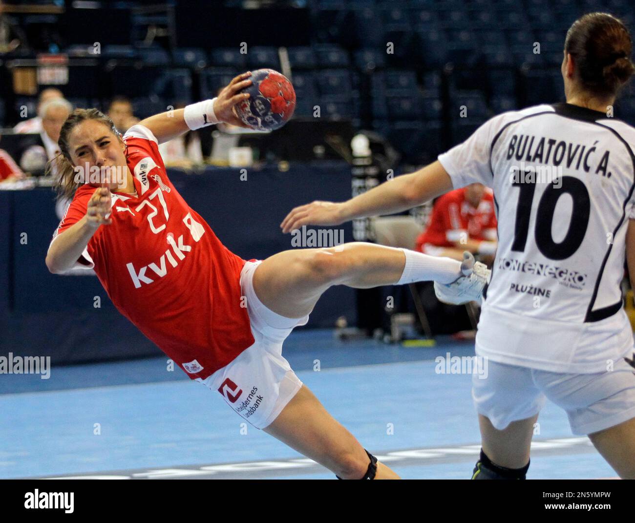 Denmark’s Louise Katharina Burgaard, left tries to score as Montenegro