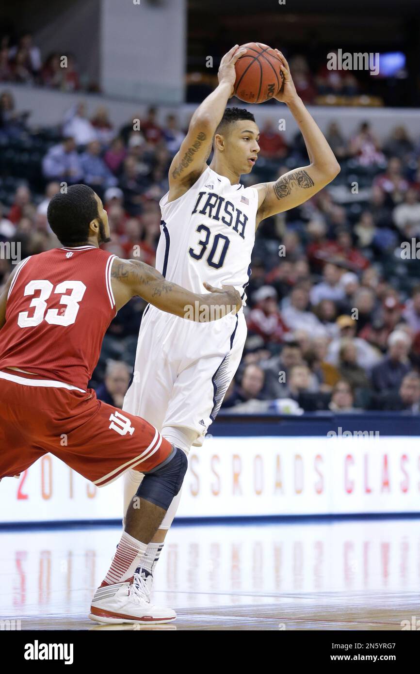 Notre Dame forward Zach Auguste, right, is defended by Indiana forward