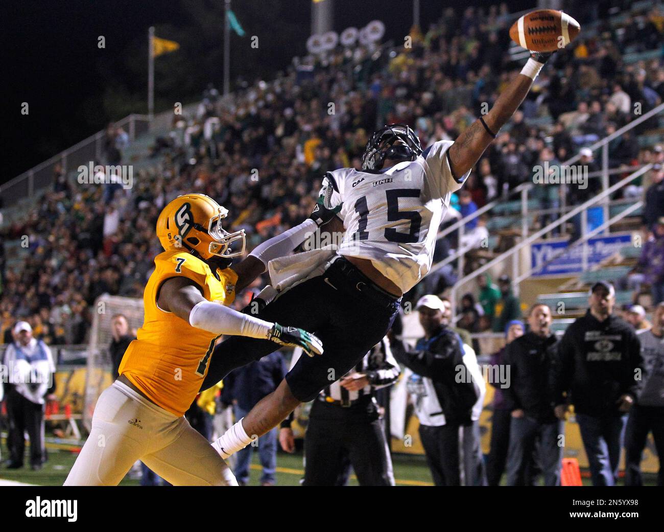New Hampshire wide receiver R.J. Harris (15) leaps for a pass just out ...