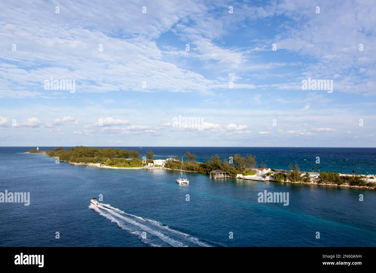 The aerial view of traveling boat in Nassau Harbour and a narrow strip