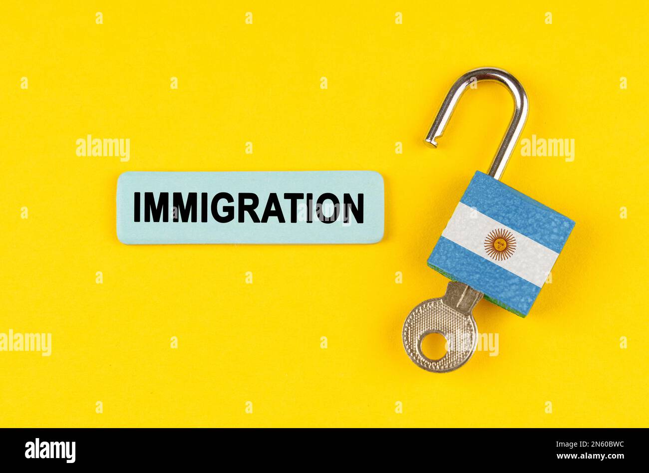On a yellow surface, an open lock with the image of the flag of ...