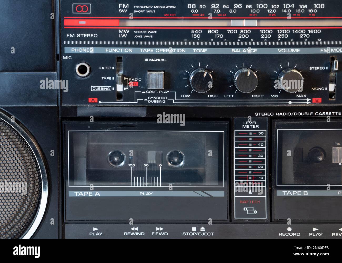 Detail from vintage Cassette player with radio with silver buttons. Stock Photo