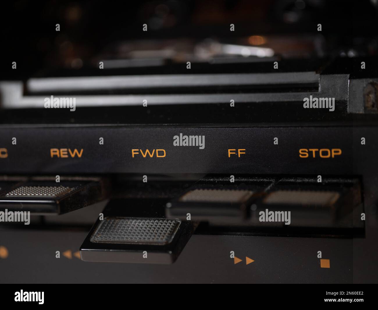 Pressed toggle switch of a tape deck to fast forward a music cassette