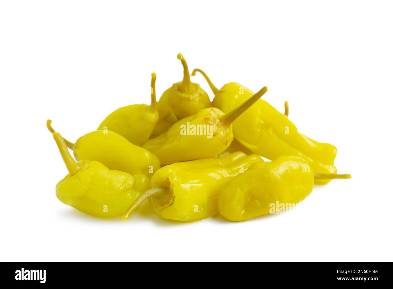 Pile of pickled yellow peppers, pepperoncini or friggitelli isolated on white background. Hot pepper marinated, brined. Traditional Italian and greek Stock Photo