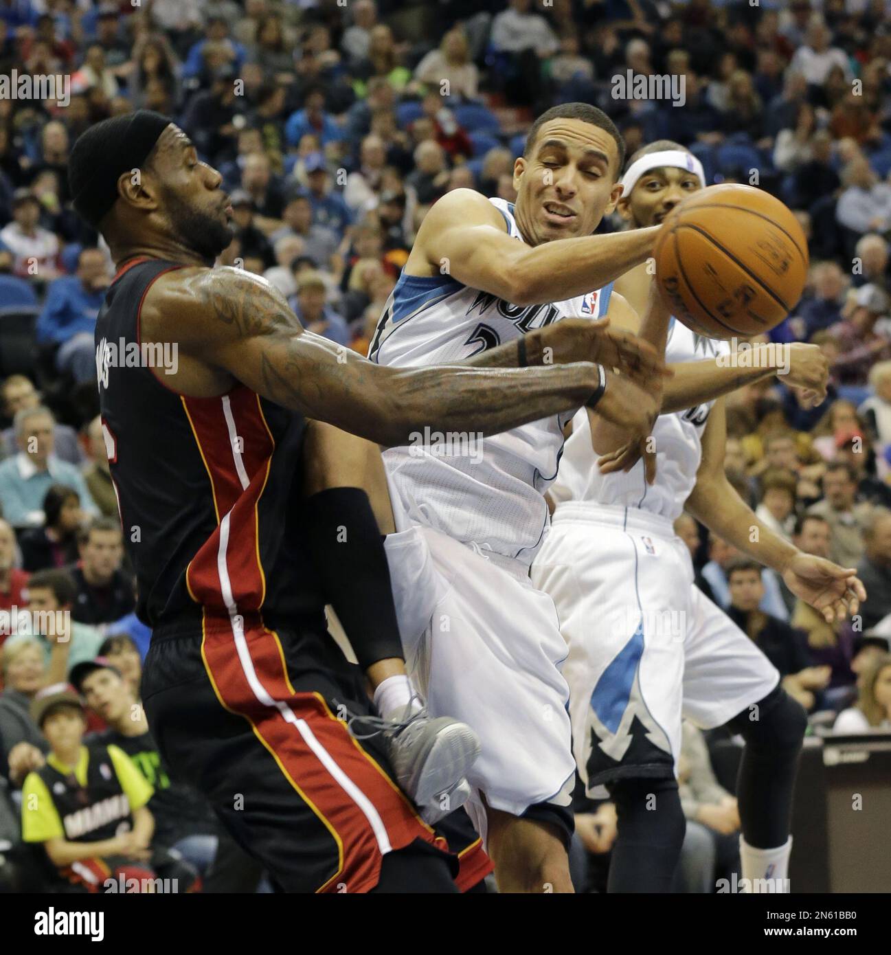 Miami Heat Forward LeBron James, Left, Knocks A Rebound Away From ...