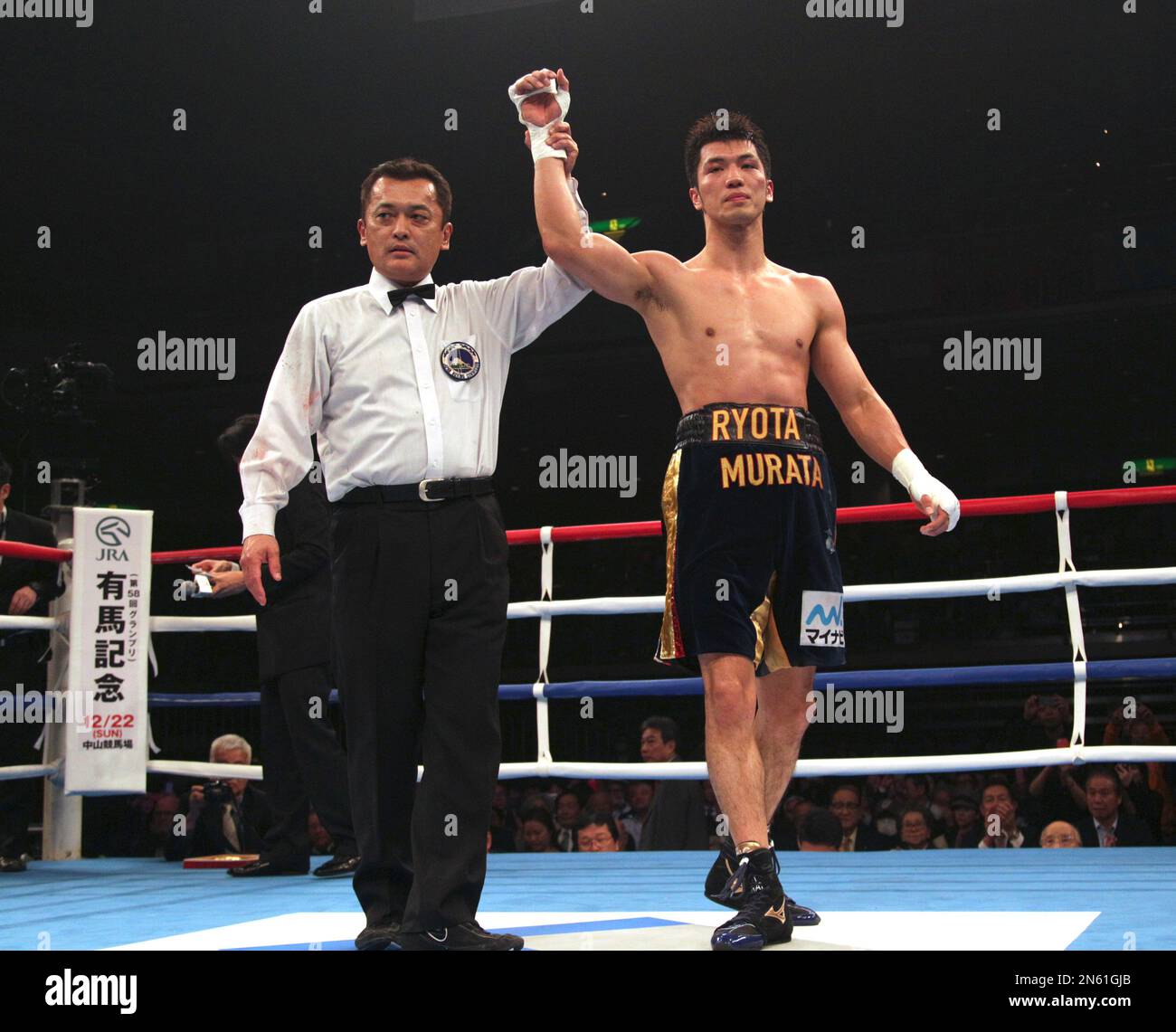 Japan’s Ryota Murata is declared the winner by the referee after