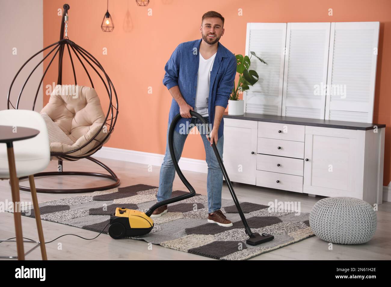 Using vacuum cleaner hi-res stock photography and images - Alamy