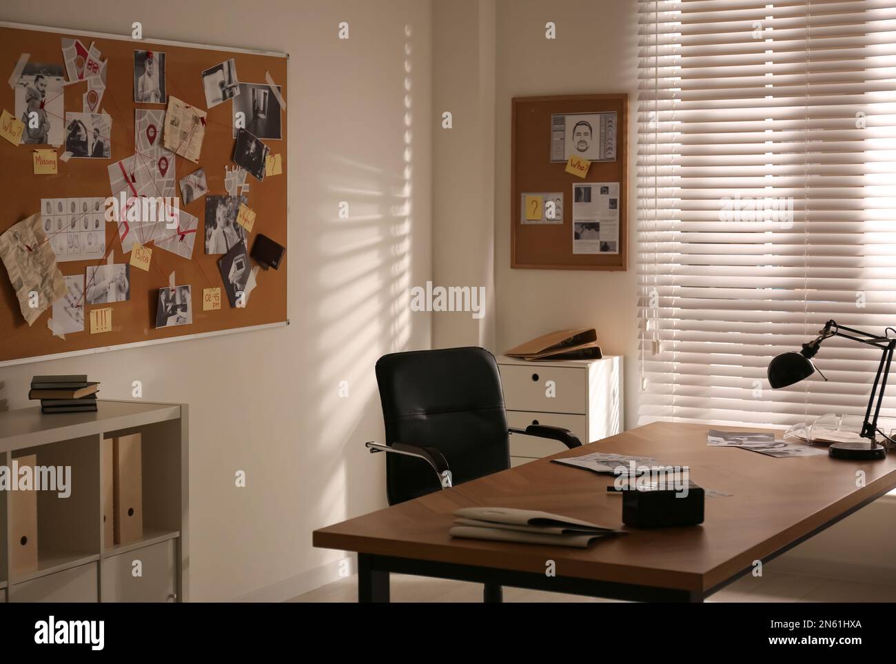 Detective workplace and evidence board in modern office Stock Photo