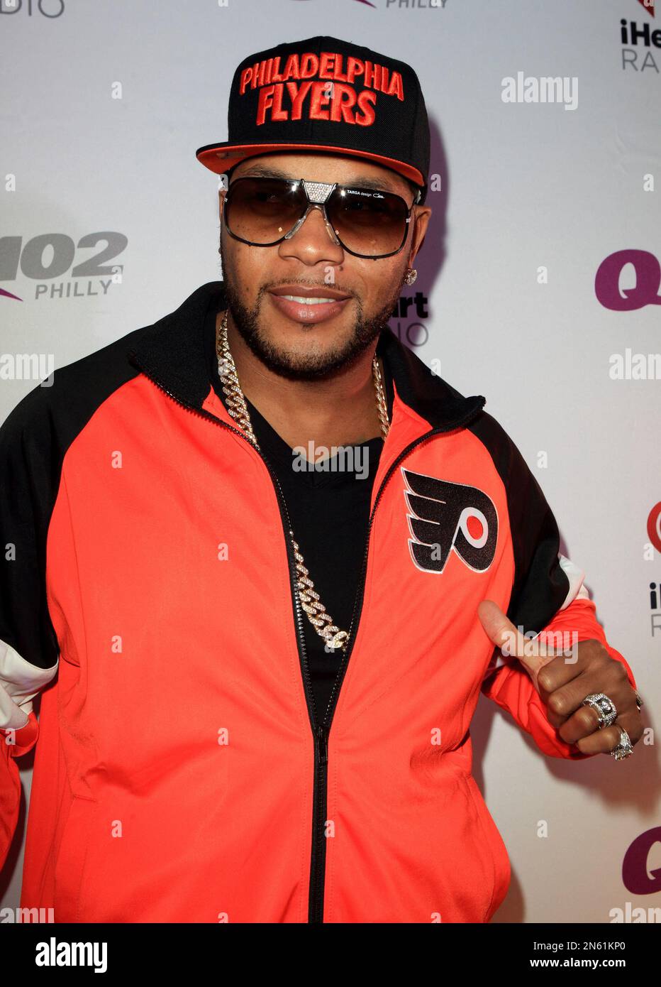 Rapper Flo Rida poses for photographers backstage during the Q102 ...