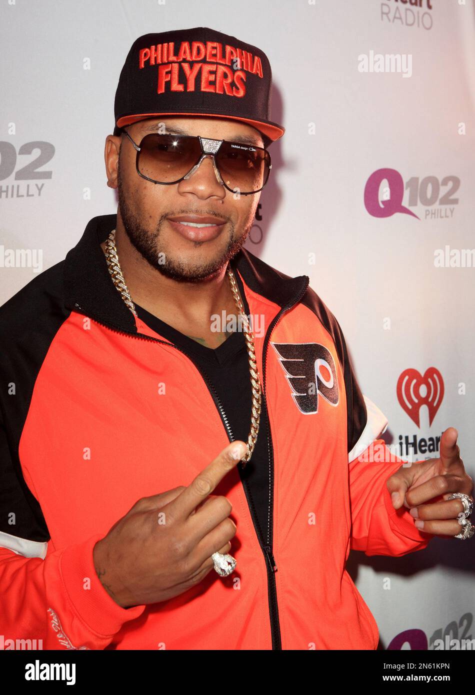 Rapper Flo Rida poses for photographers backstage during the Q102 ...