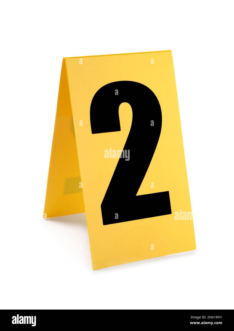 Yellow crime scene marker with number two on white background Stock Photo