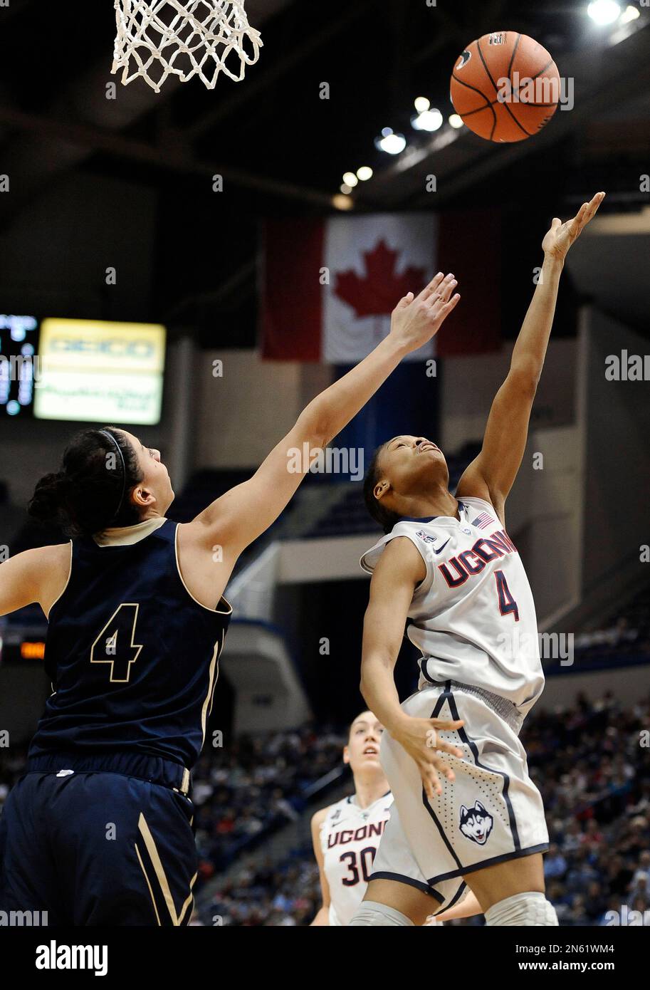 Connecticut's Moriah Jefferson, right, shoots over UC Davis' Idit Oryon
