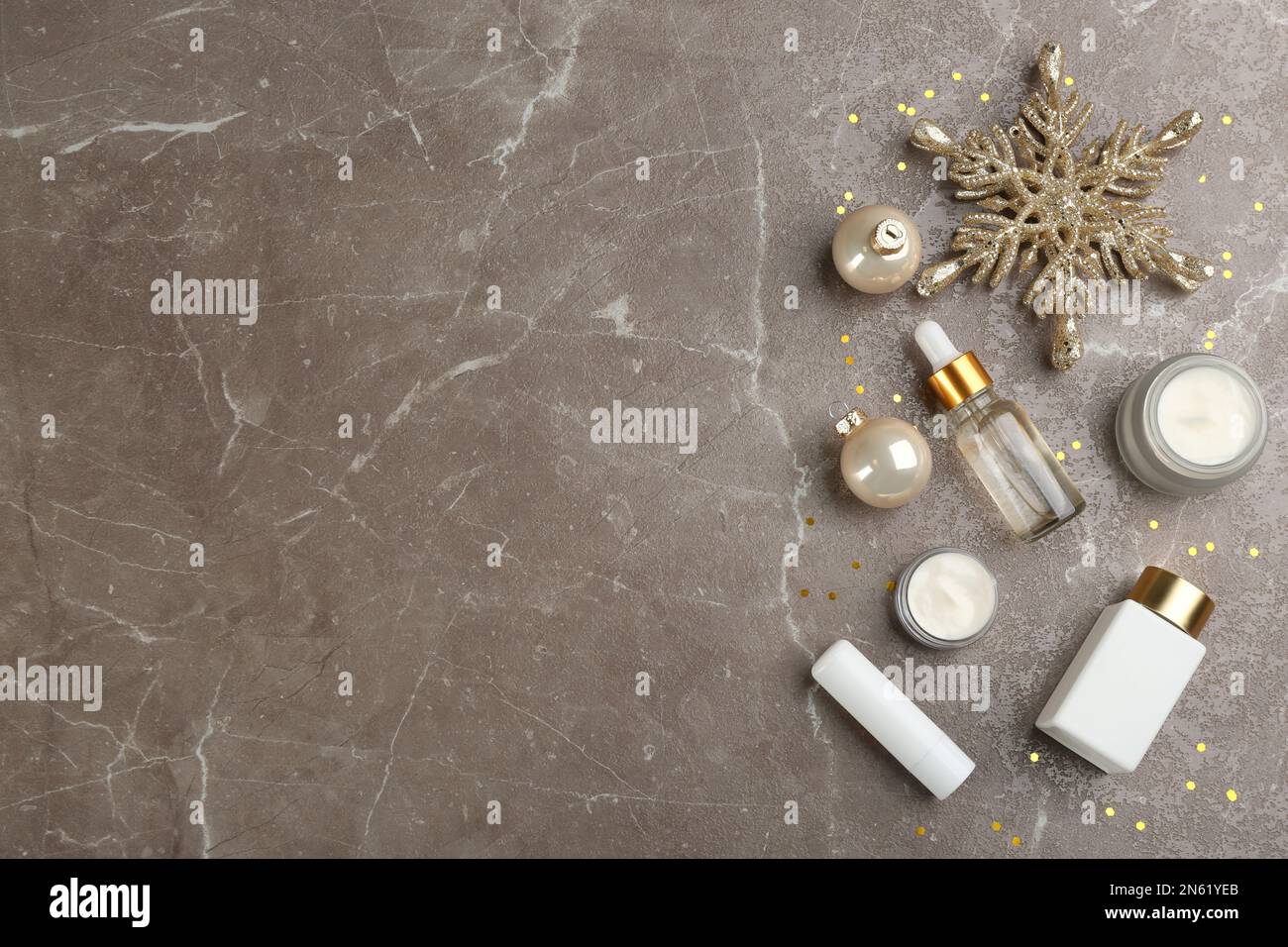 Flat lay composition with different cosmetic products on grey table ...