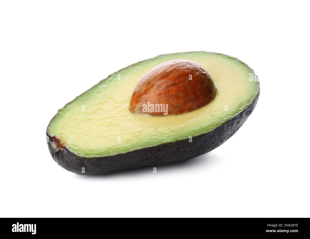 Half of ripe avocado with pit isolated on white Stock Photo - Alamy