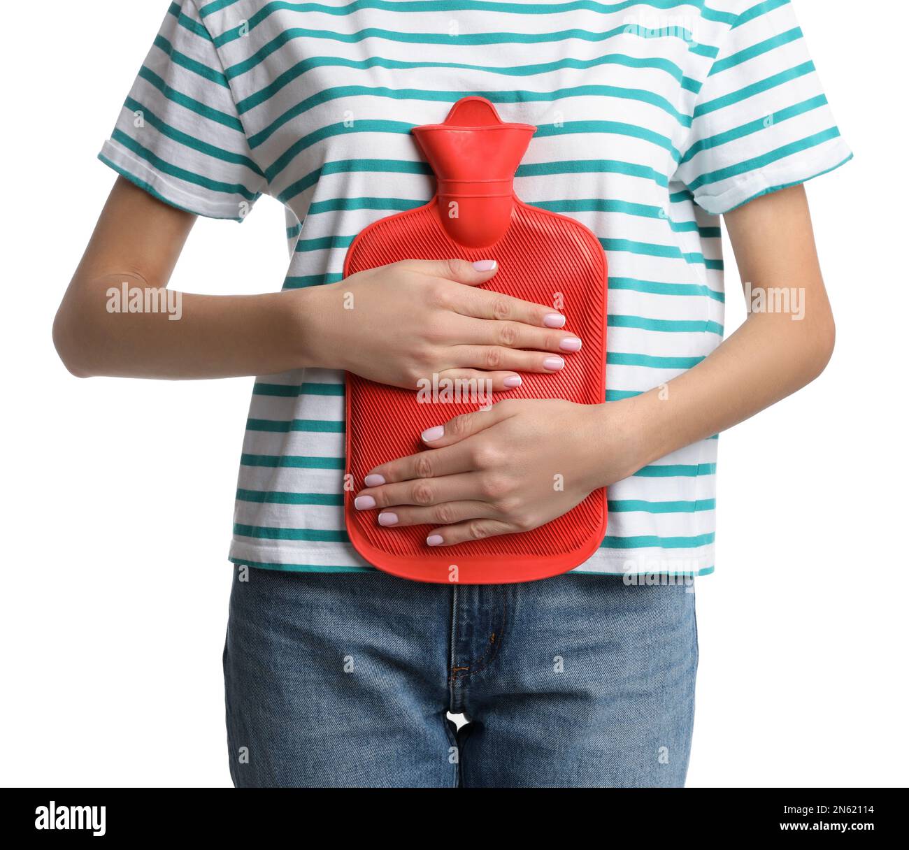 Woman using hot water bottle to relieve abdominal pain on white