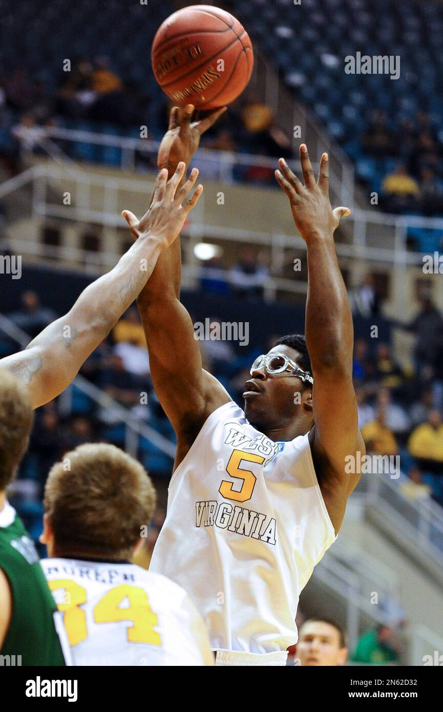 West Virginia's Devin Williams (5) looks to shoot during the second half of  an NCAA college basketball game Monday, Dec. 2, 2013, in Morgantown, W.Va. West  Virginia won 96-47. (AP Photo/Andrew Ferguson