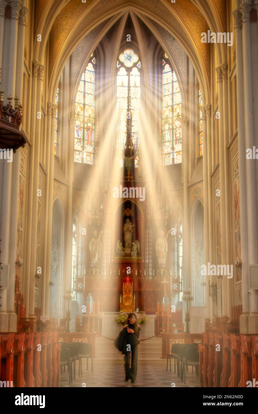 Sunlight streaming through church window. Beams of light in Church. Cathedral windows with sun rays. Religion and christianity concept Stock Photo