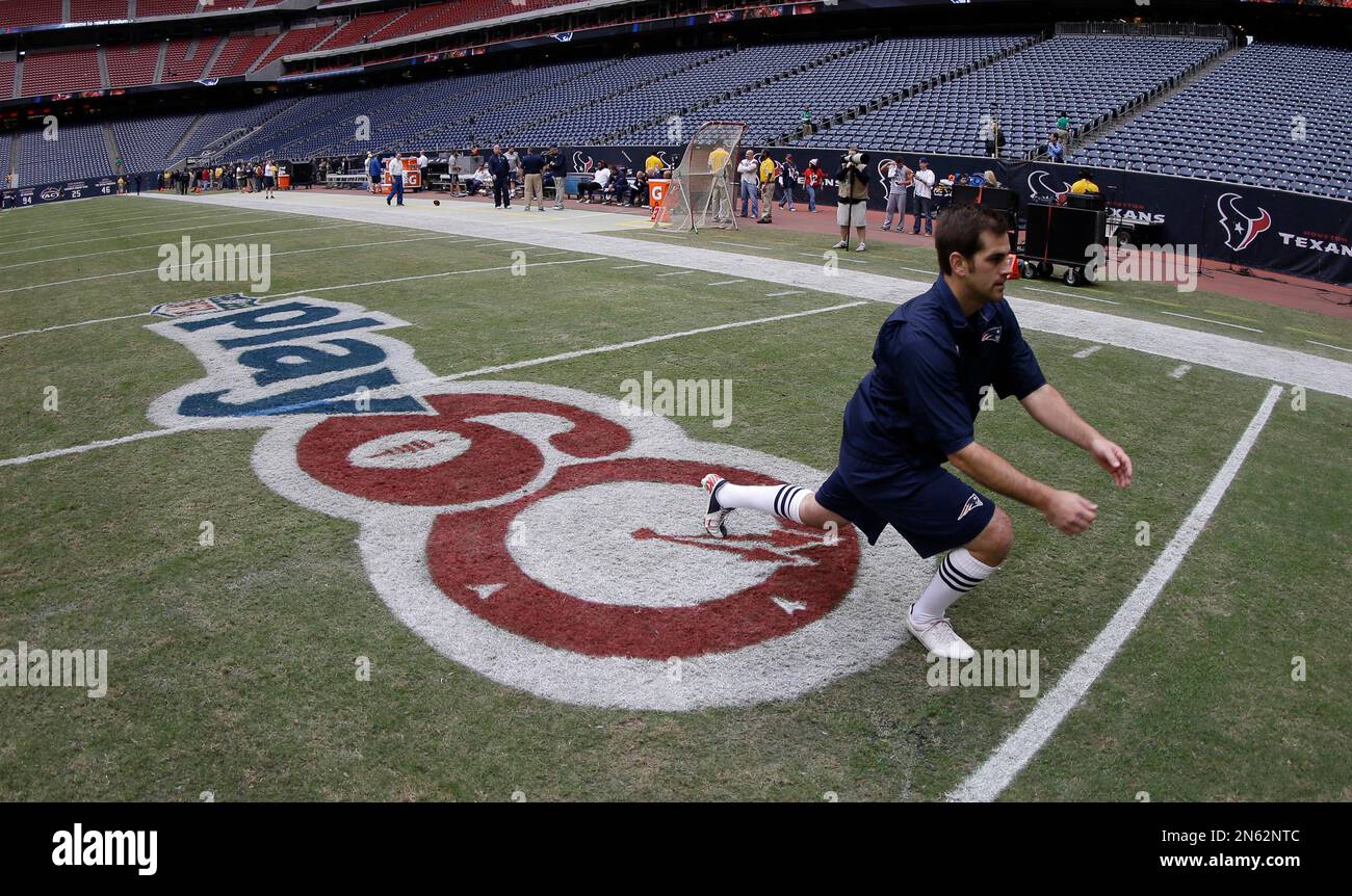 New England Patriots' Zoltan Mesko, left, holds the ball as Stephen  Gostowski kicks during football training camp, Friday, July 30, 2010, in  Foxborough, Mass. (AP Photo/Michael Dwyer Stock Photo - Alamy