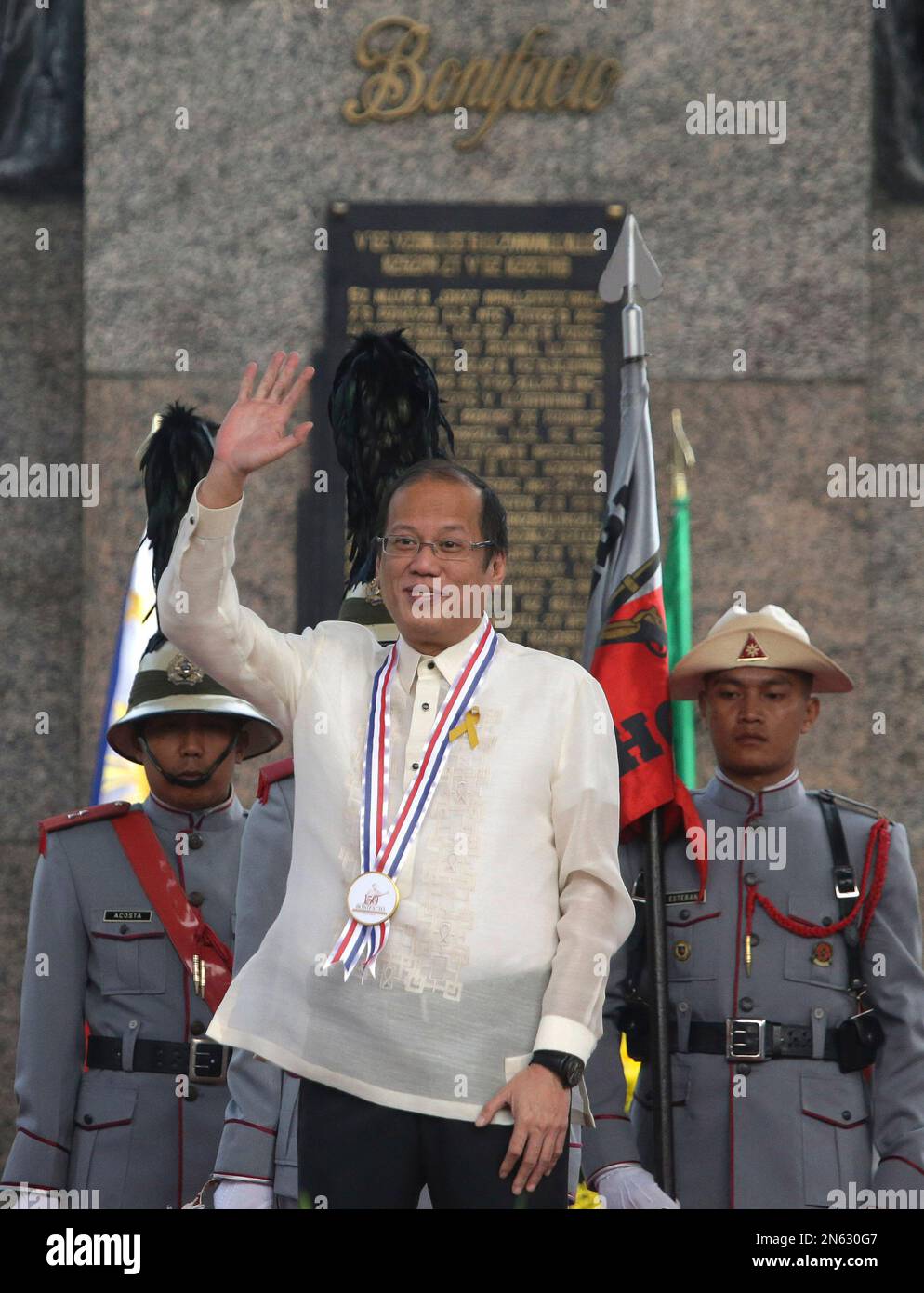 Philippine President Benigno Aquino III, Center, Waves After Laying A ...