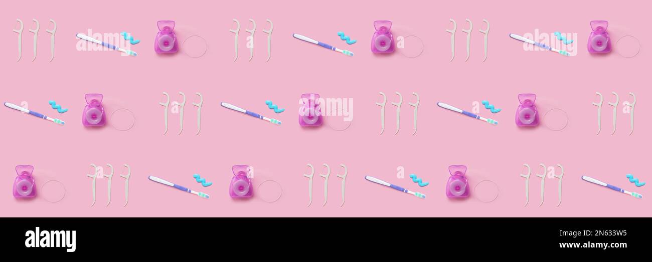 Many toothbrushes with dental floss and toothpicks on pink background ...