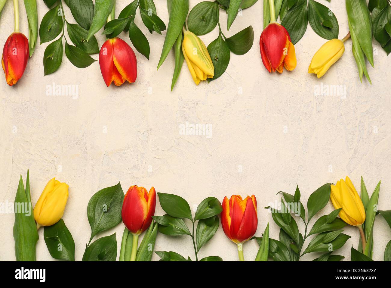 Composition with beautiful tulip flowers and plant branches on light background Stock Photo