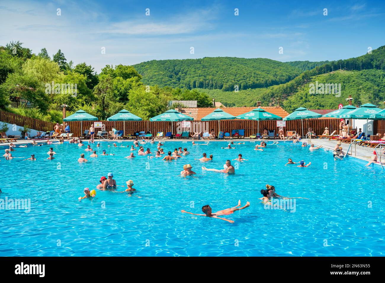 People enjoy salt water pool in Praid, Transylvania, Romania Stock Photo