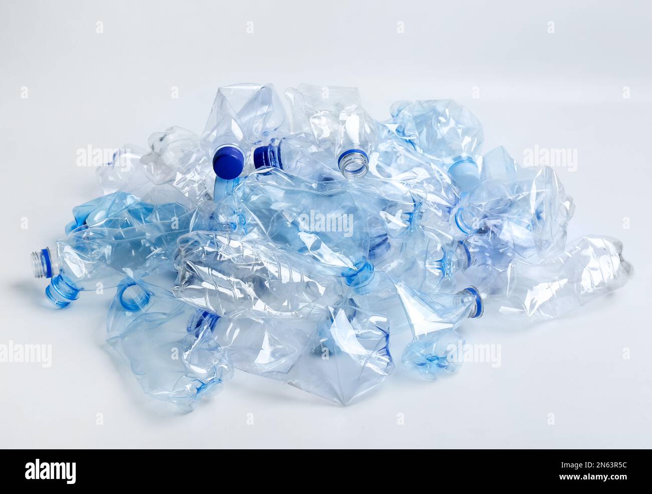 Curated visual reference: Heap Of Used Plastic Bottles On White Background Recycling Problem Photo Inspiration