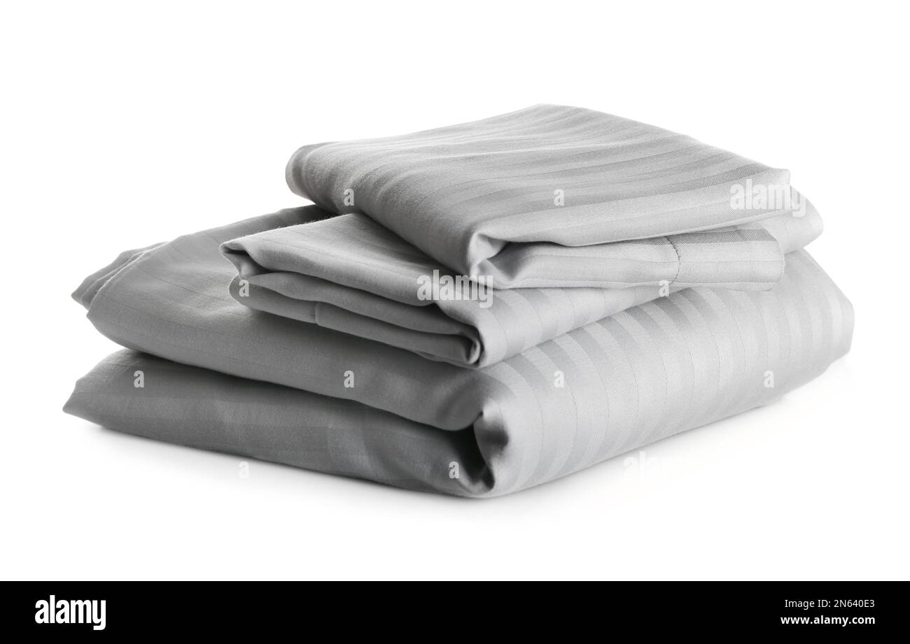 Stack of clean bed sheets isolated on white Stock Photo Alamy