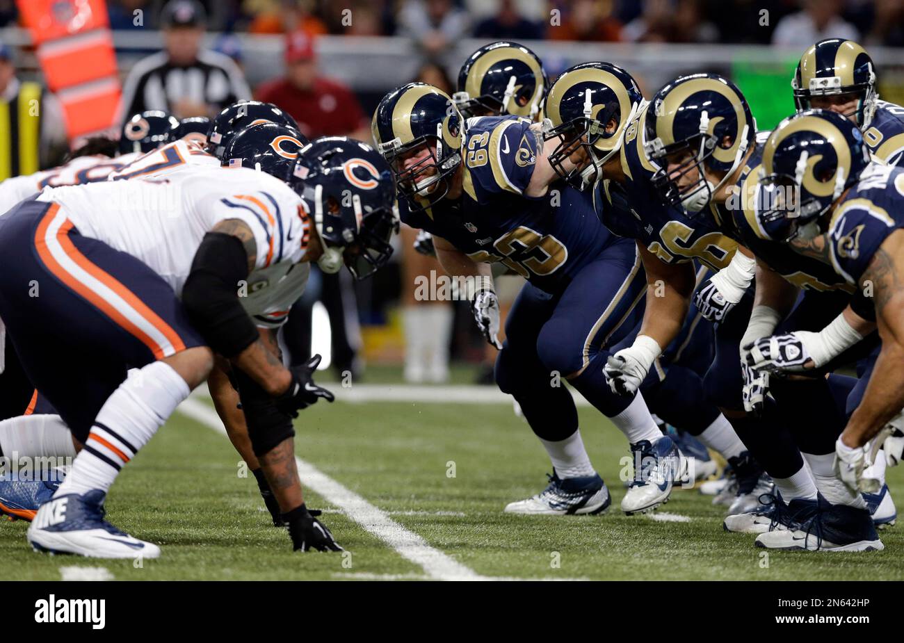 Members of the St. Louis Rams, right, and Chicago Bears after the snap ...