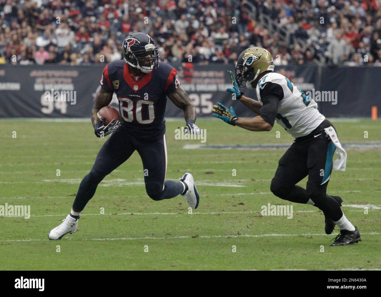 Houston Texans wide receiver Andre Johnson (80) is tackled by
