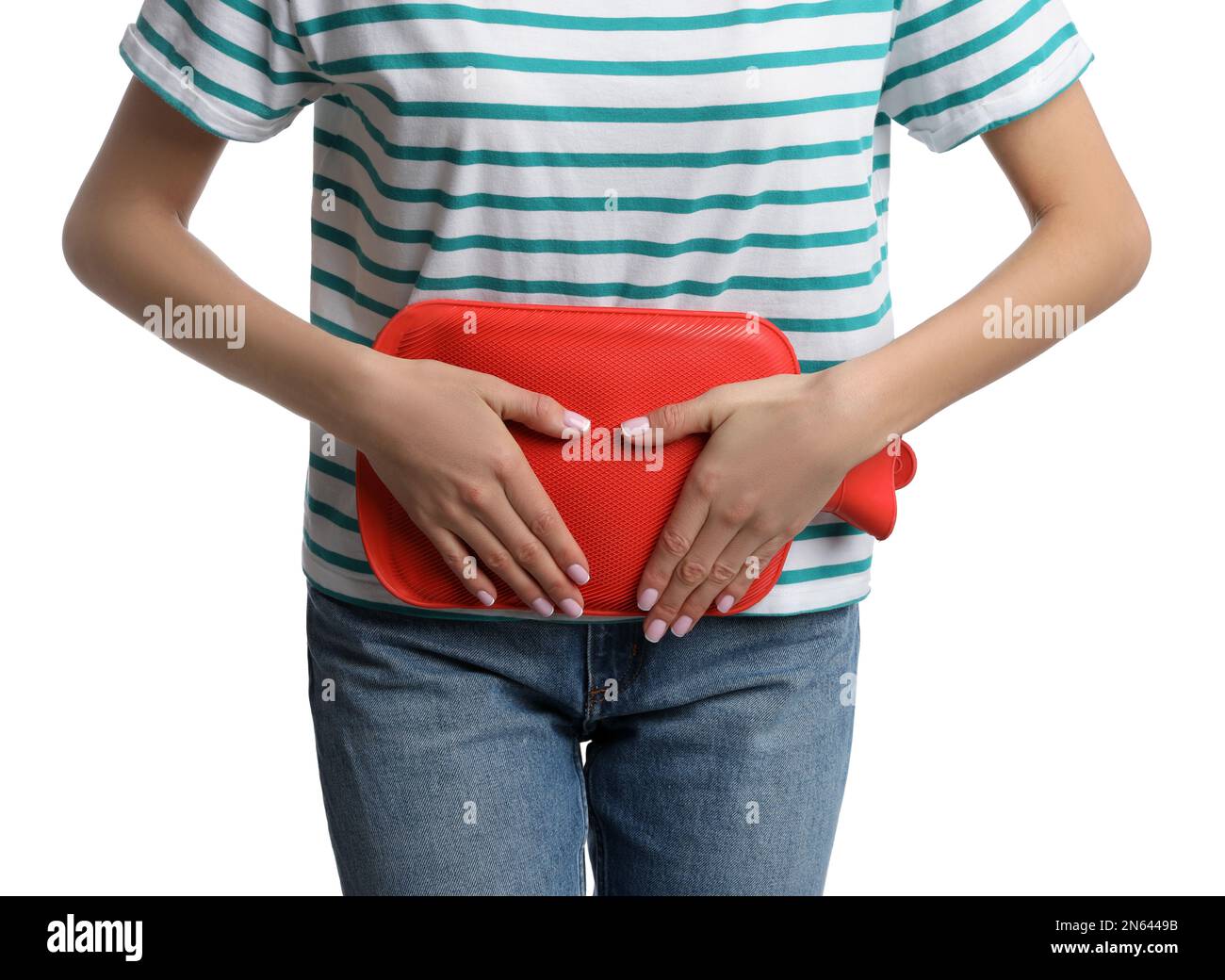 Woman using hot water bottle to relieve menstrual pain on white background, closeup Stock Photo