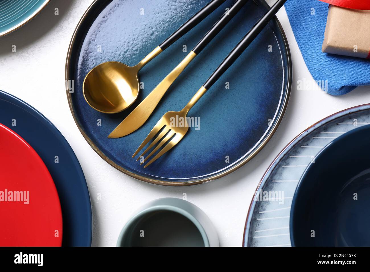 Set of dishware and cutlery on white background, flat lay Stock Photo ...