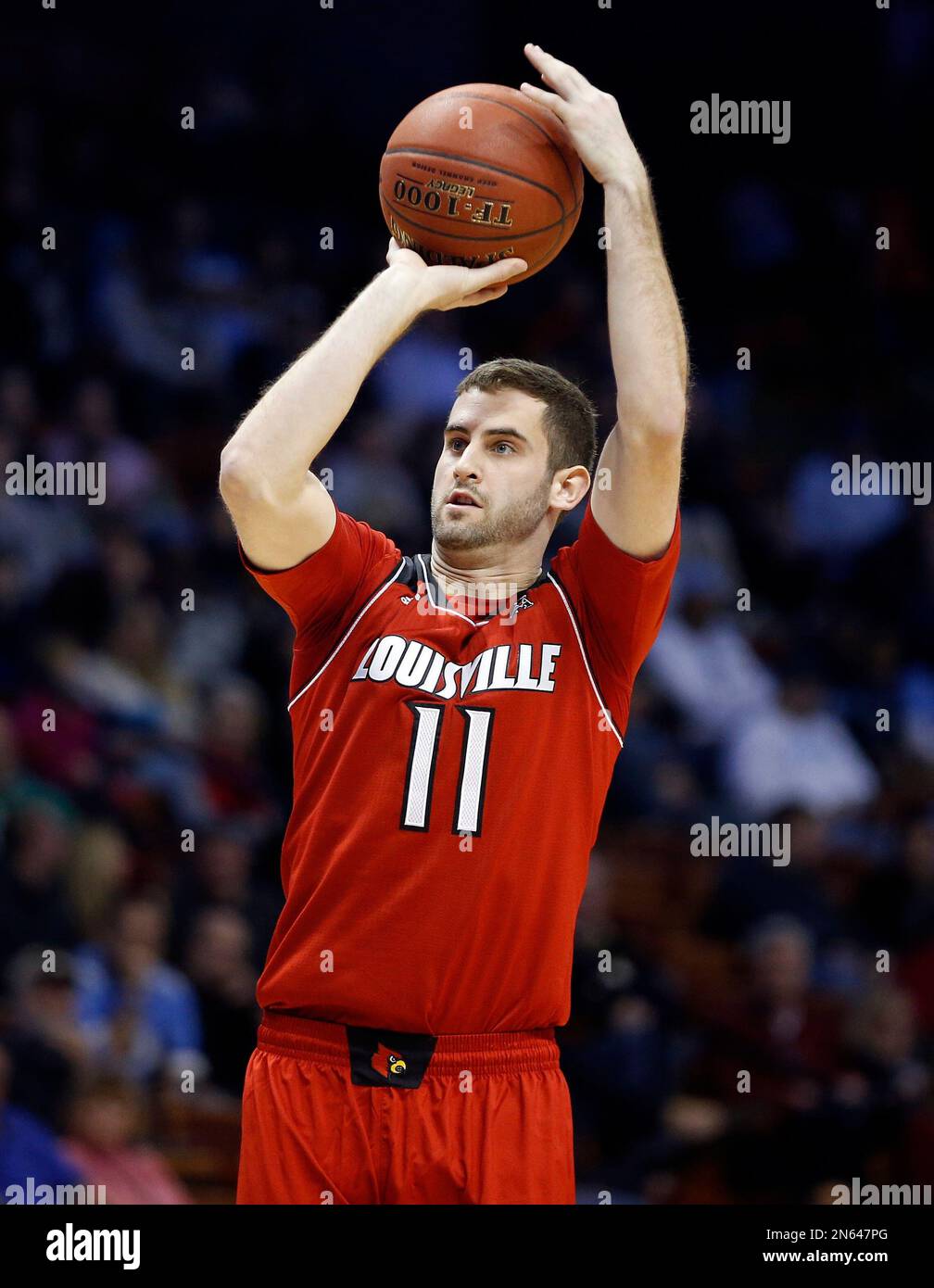 Louisville's Luke Hancock (11) shoots during the second half of an NCAA