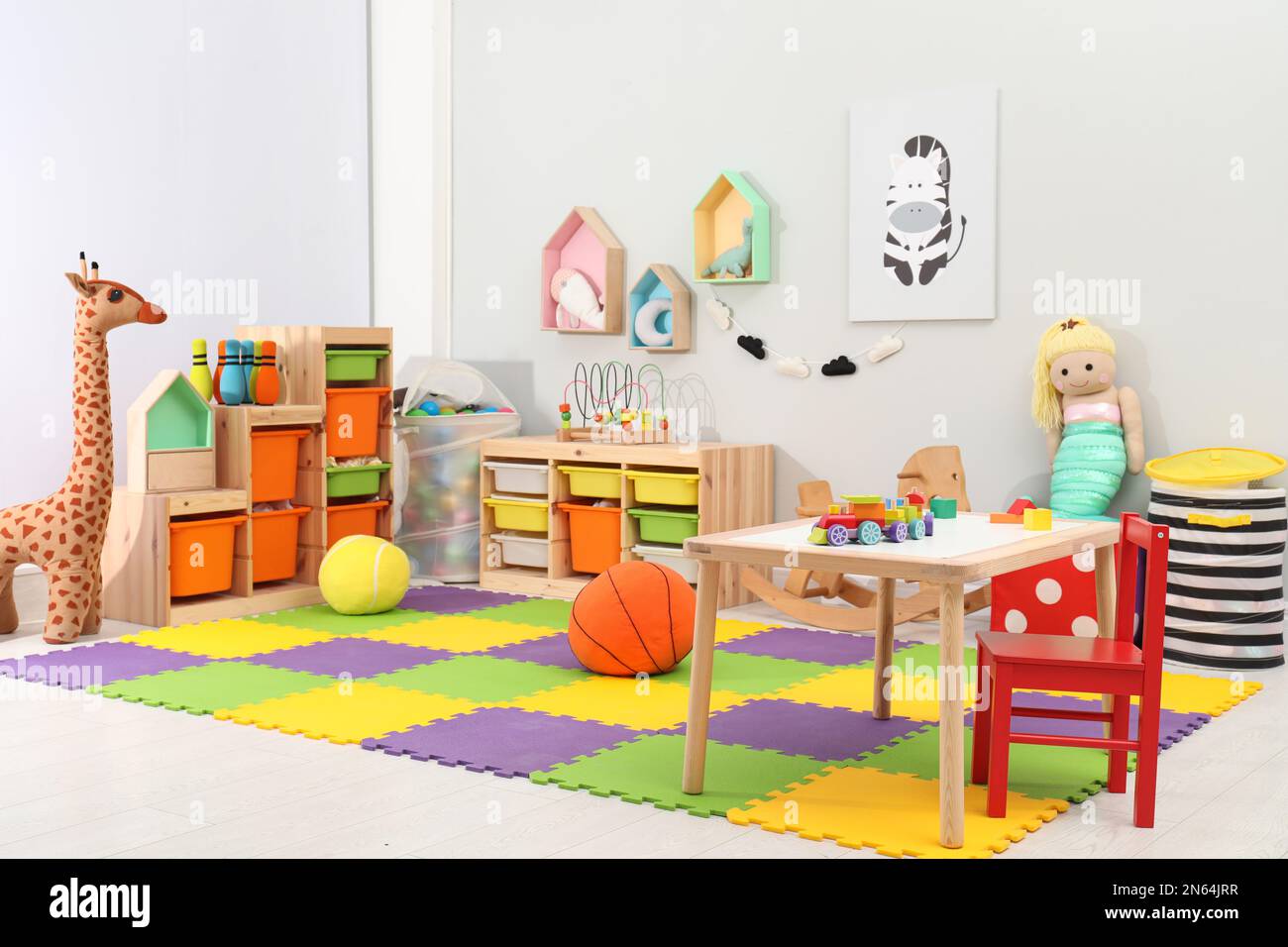 Cute child's room interior with toys and modern furniture Stock Photo ...