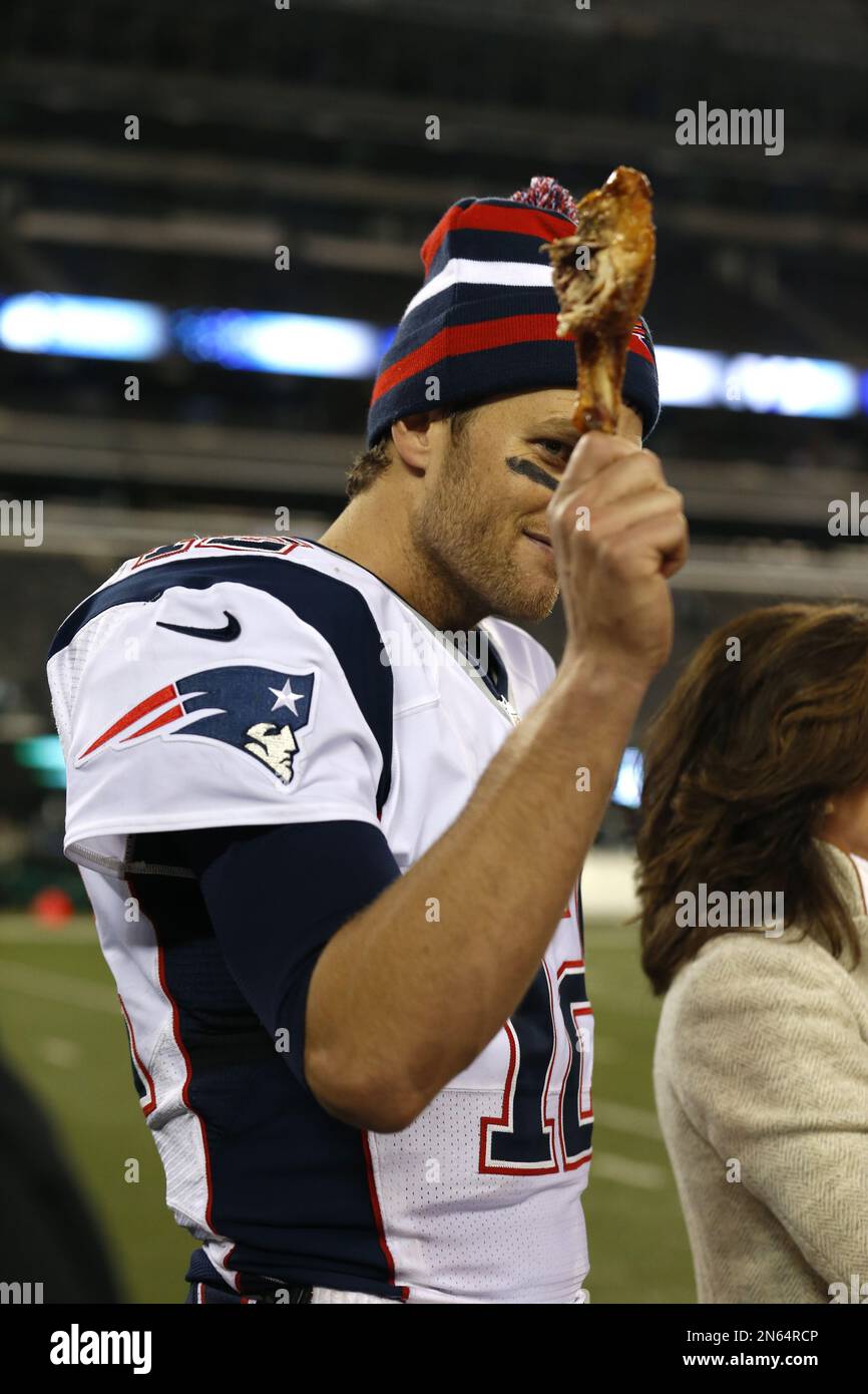 New England Patriots quarterback Tom Brady holds a turkey leg after an NFL  football game against the New York Jets Thursday, Nov. 22, 2012 in East  Rutherford, N.J. The Patriots won the