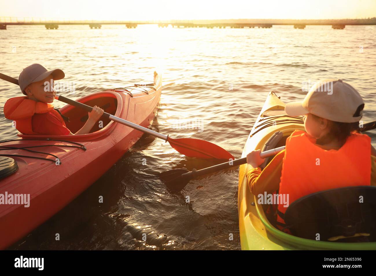 Little children kayaking on river. Summer camp activity Stock Photo - Alamy