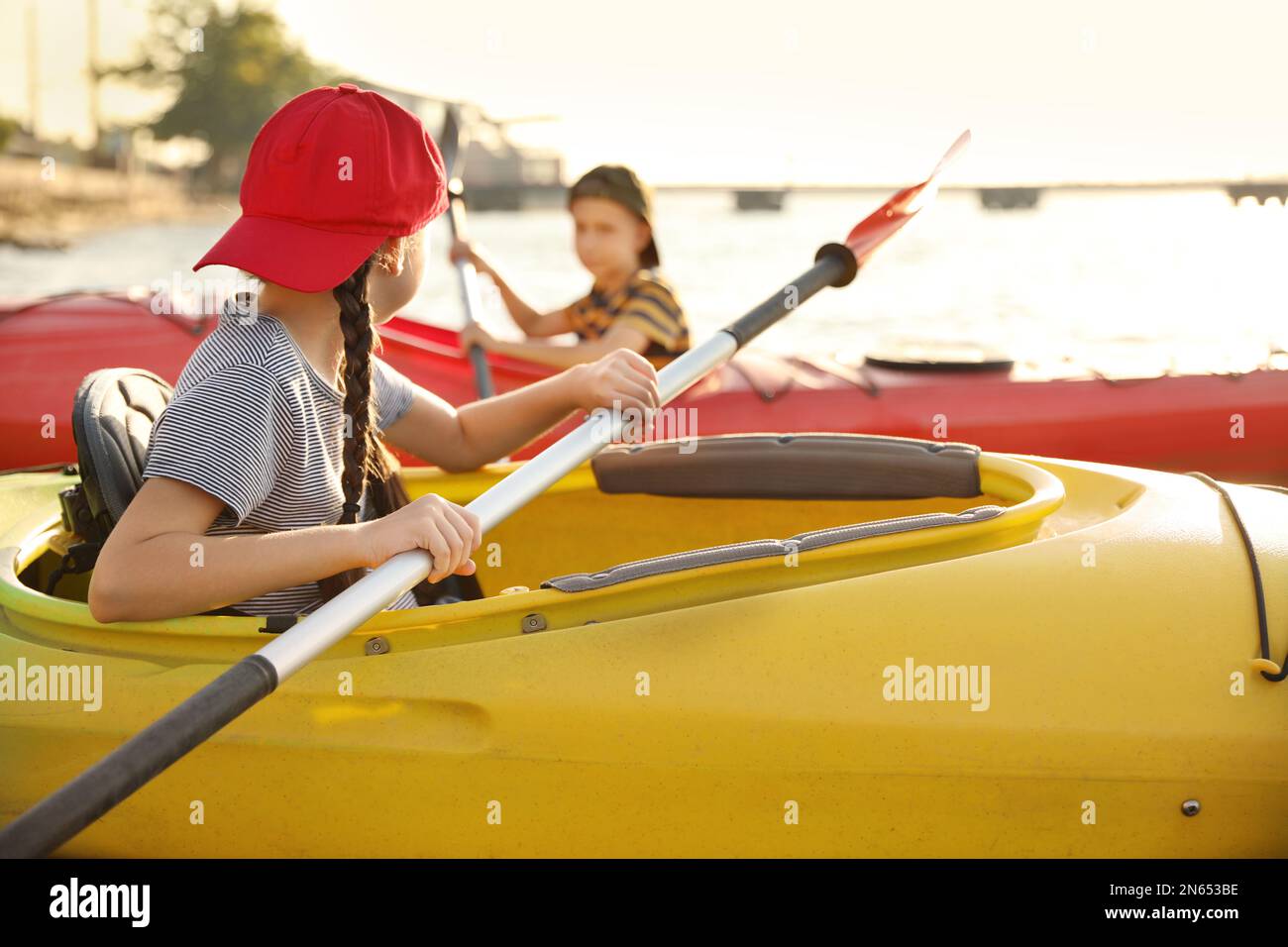 Little children kayaking on river. Summer camp activity Stock Photo - Alamy
