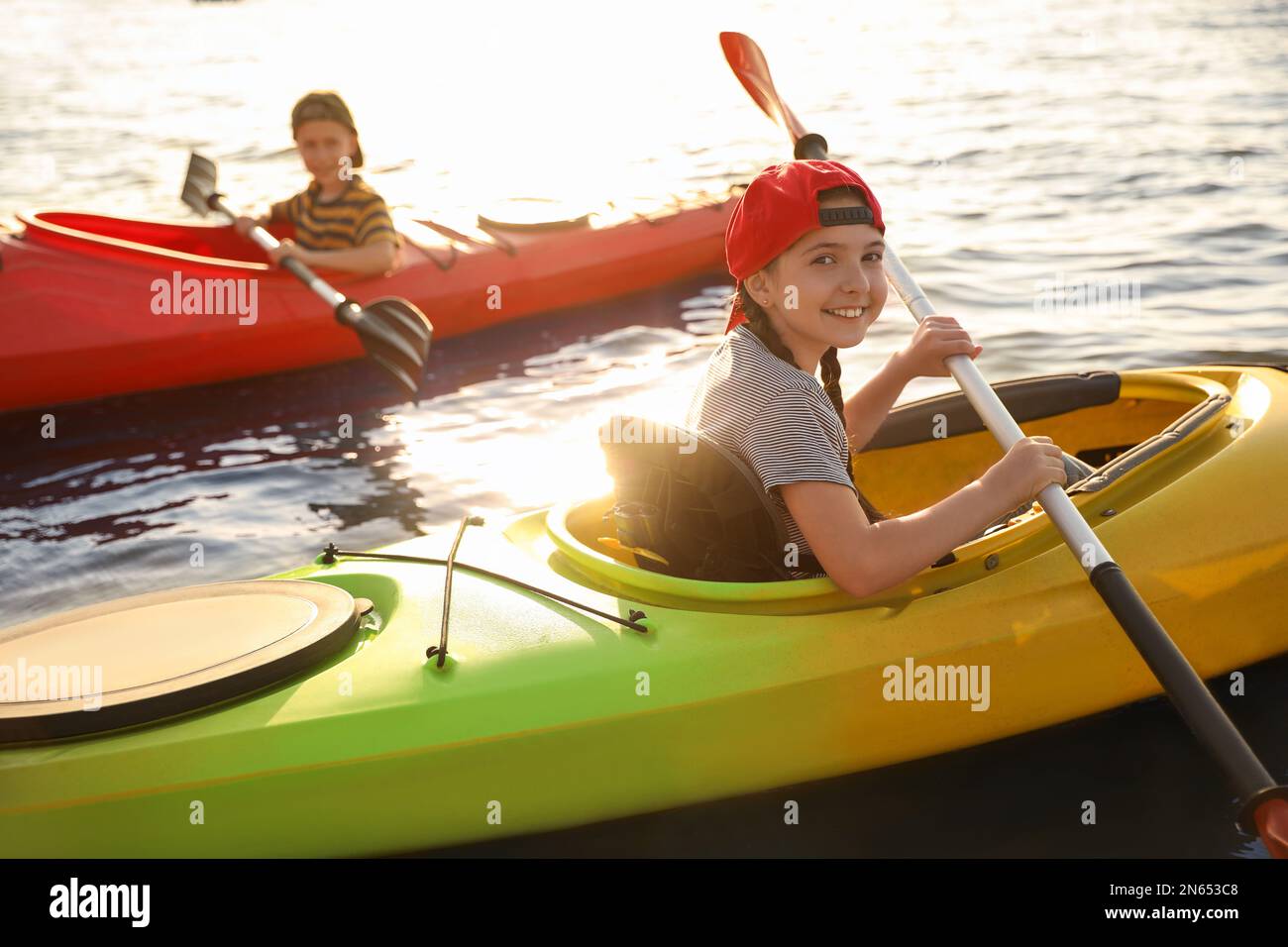 Little children kayaking on river. Summer camp activity Stock Photo - Alamy