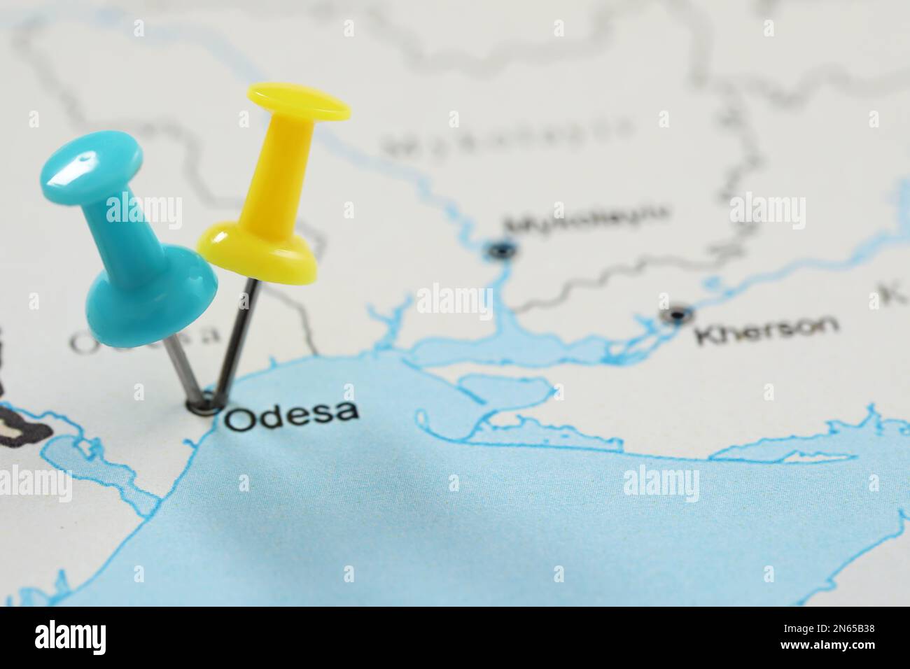 MYKOLAIV, UKRAINE - NOVEMBER 09, 2020: Odesa city marked with push pins on contour map of Ukraine, closeup Stock Photo
