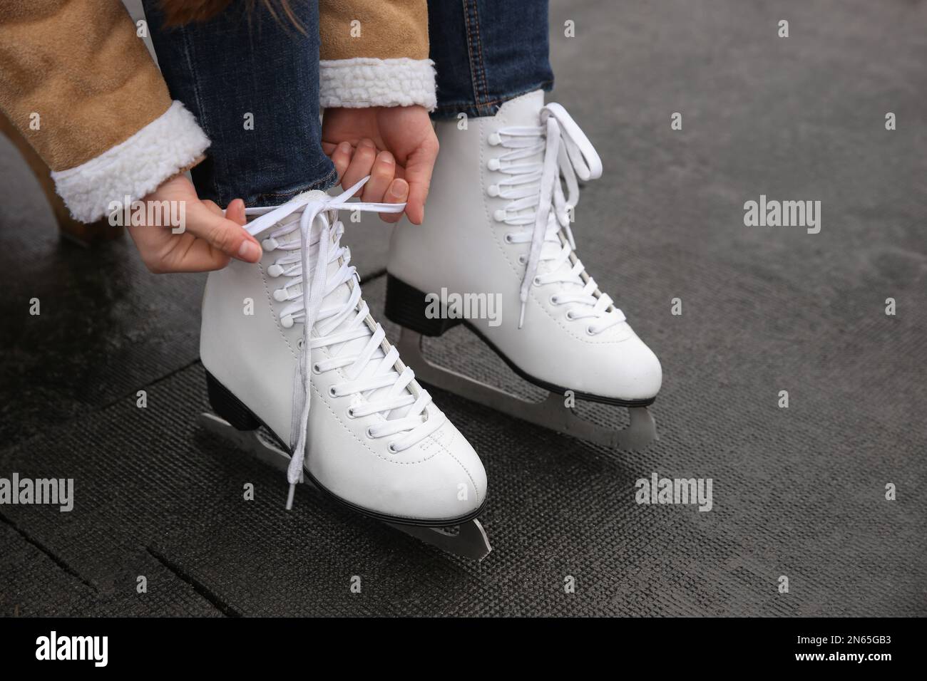 Woman lacing figure skate outdoors, closeup view Stock Photo Alamy