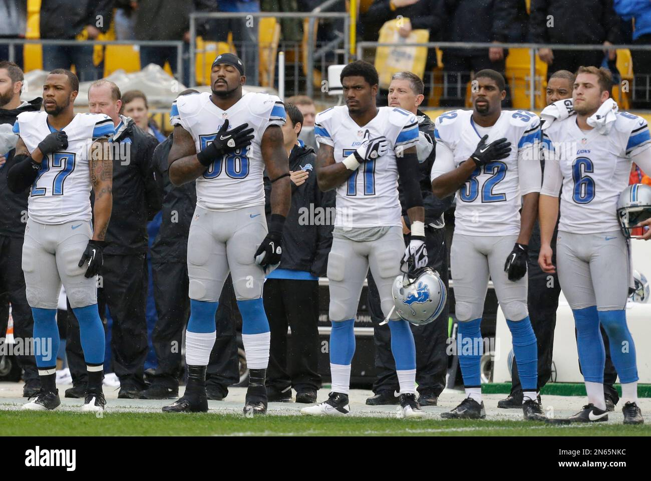 Some of the Detroit Lions during the national anthem before an NFL