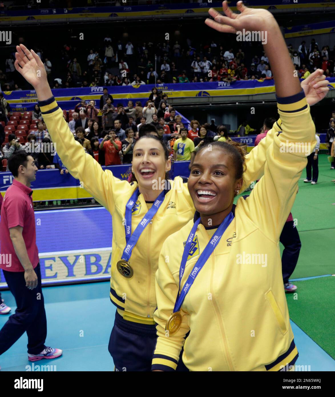 Brazil's MVP player Fabiana Claudino, right, celebrates with teammates after winning the World