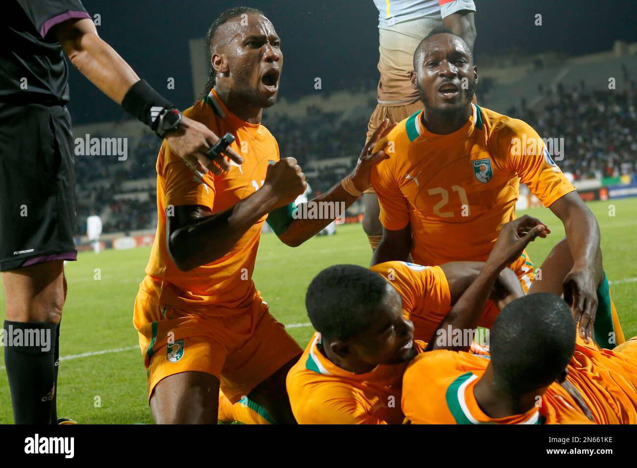 Ivory Coast's Didier Drogba, left, and Sio Giovanni, right, celebrate