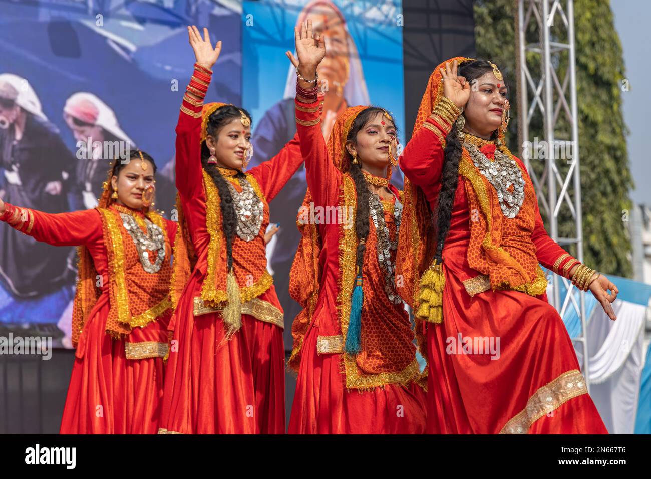 Tribal women of Uttarakhand wearing traditional attire dancing in their ...