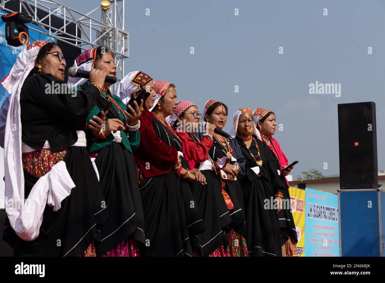 Tribal women of Uttarakhand wearing traditional attire singing folklore