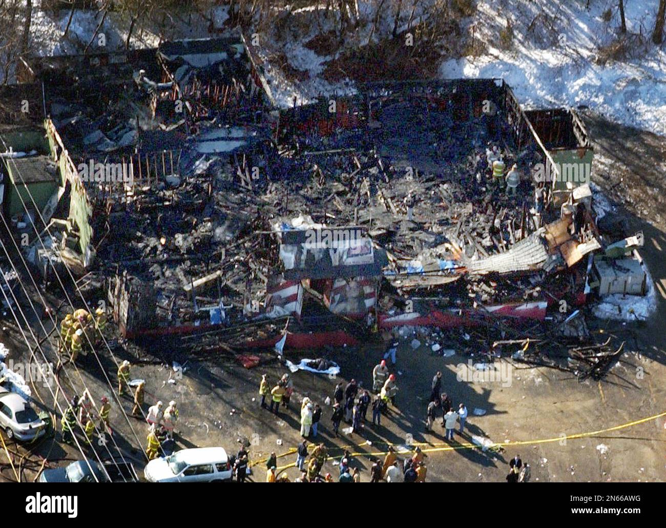 File In this Feb. 21, 2003 file photo fire fighters continue to investigate the burned out
