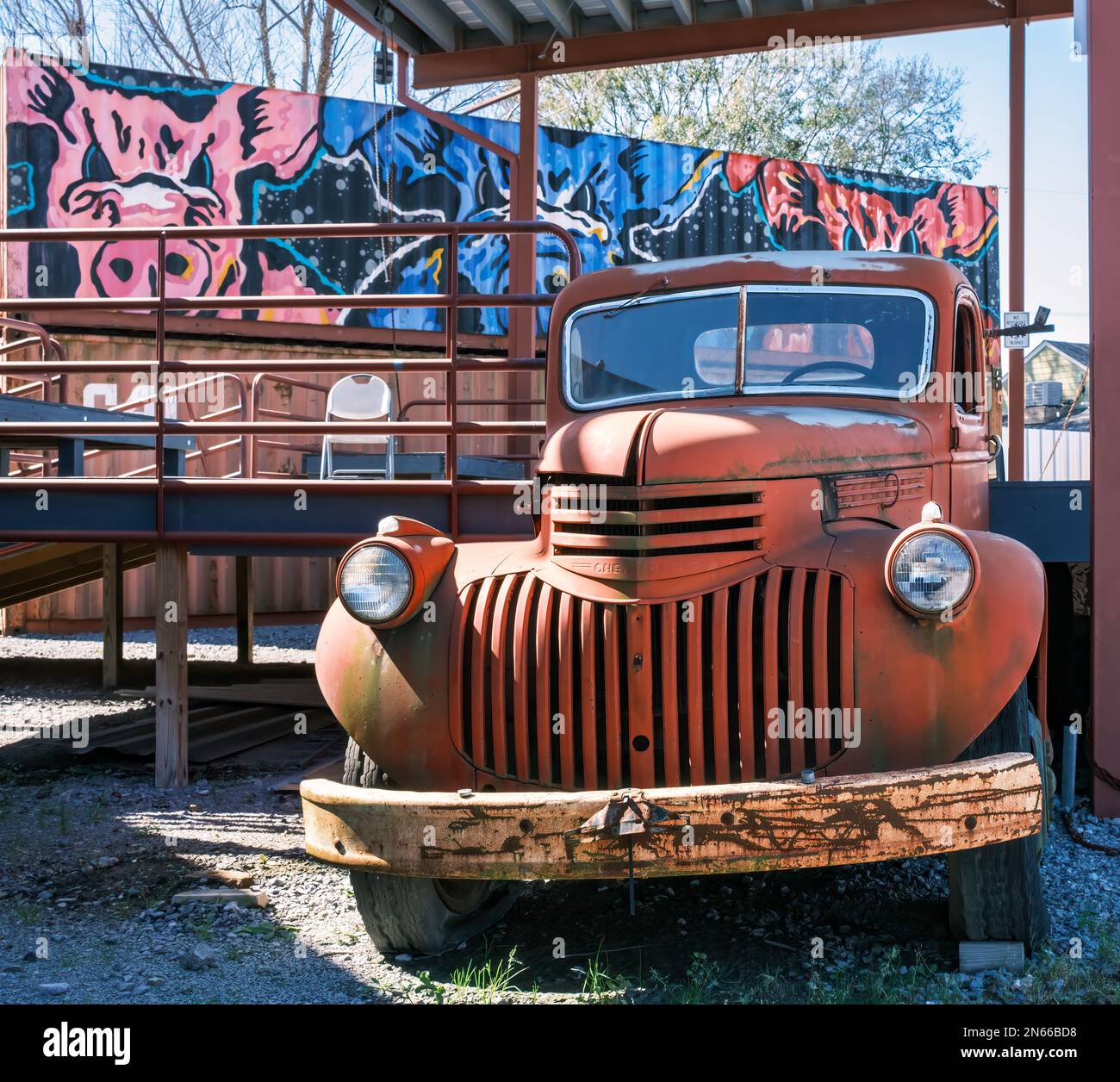 NEW ORLEANS, LA, USA: FEBRUARY 5, 2023: Rusted antique AK series 1940s Chevrolet pickup truck in the stage area of the Central City BBQ restauraunt Stock Photo