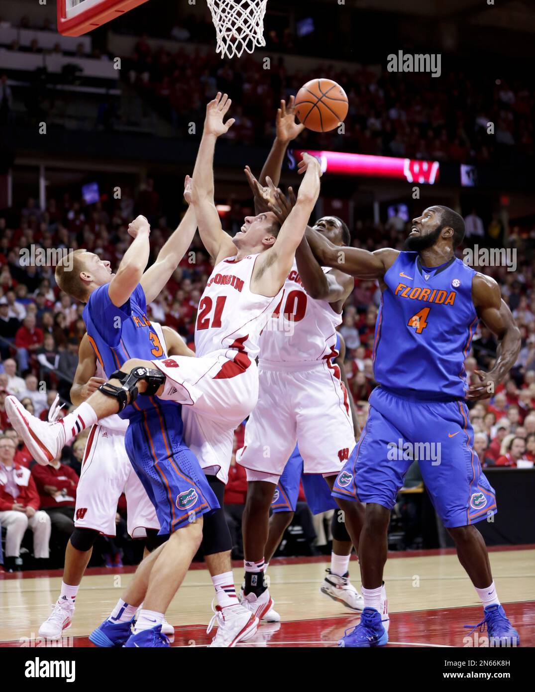 Wisconsin's Josh Gasser (21) and Nigel Hayes (10) against Florida's